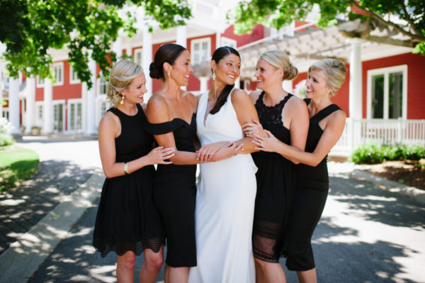 A bride and her four bridesmaids in front of the Inn at Black Star Farms.