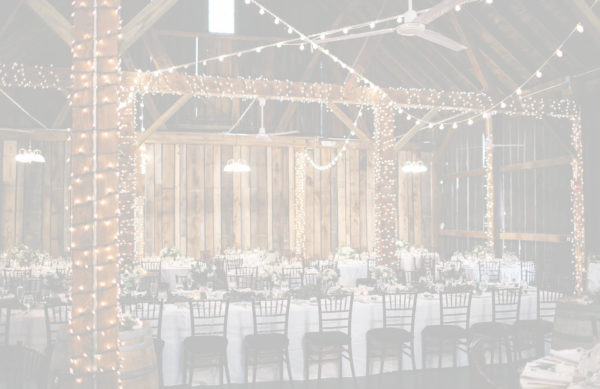 Pegasus Barn with decorated tables and lights.
