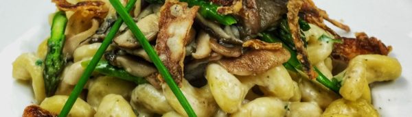 Pasta with wild mushrooms and asparagus.