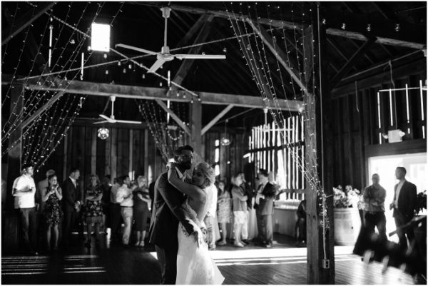 Bride and groom's first dance in the Pegasus Barn at Black Star Farms Suttons Bay.