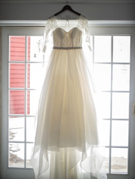 Wedding dress hanging in a window at the Inn at Black Star Farms.