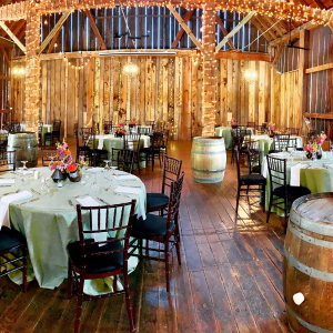 Pegasus Barn set with round tables for a wedding reception.
