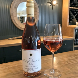 Bottle and glass of our Wine Club Selection Rose of Pinto Gris.