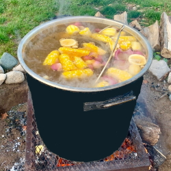 Great Lakes Fish Boil pot on the fire at the Hearth and Vine Cafe at Black Star Farms Suttons Bay.
