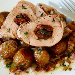Example of cherry stuffed pork tenderloin over potatoes, part of our Mother's Day Brunch To-Go.