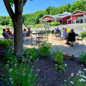 People dining outdoors on cafe patio.