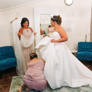 Bride getting ready in bridal suite.
