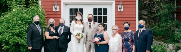 Small wedding party wearing masks.