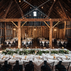 Decorated wedding reception tables in the Pegasus Barn.