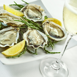 Oysters with lemon and sparkling wine.