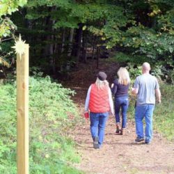 People hiking the trails at Black Star Farms.