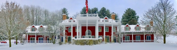 View of the front of the Inn with snow on the ground.