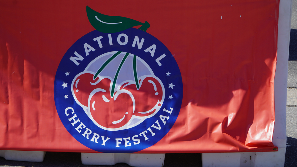 Banner for the National cherry Festival in Traverse City, a great place to enjoy cherry picking in Michigan