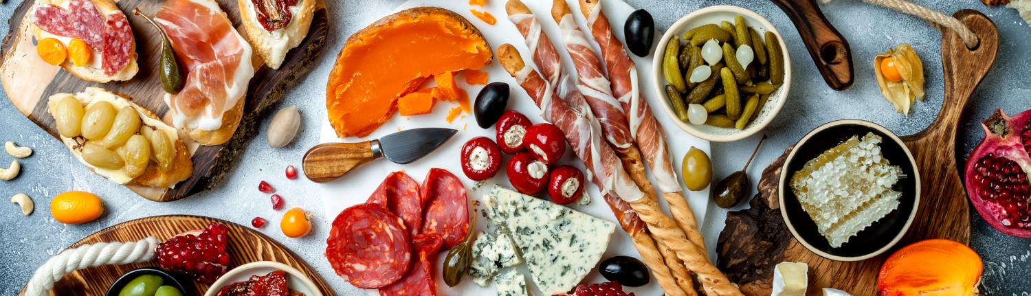 Meats,. cheeses, vegetables, and more to make a charcuterie board.