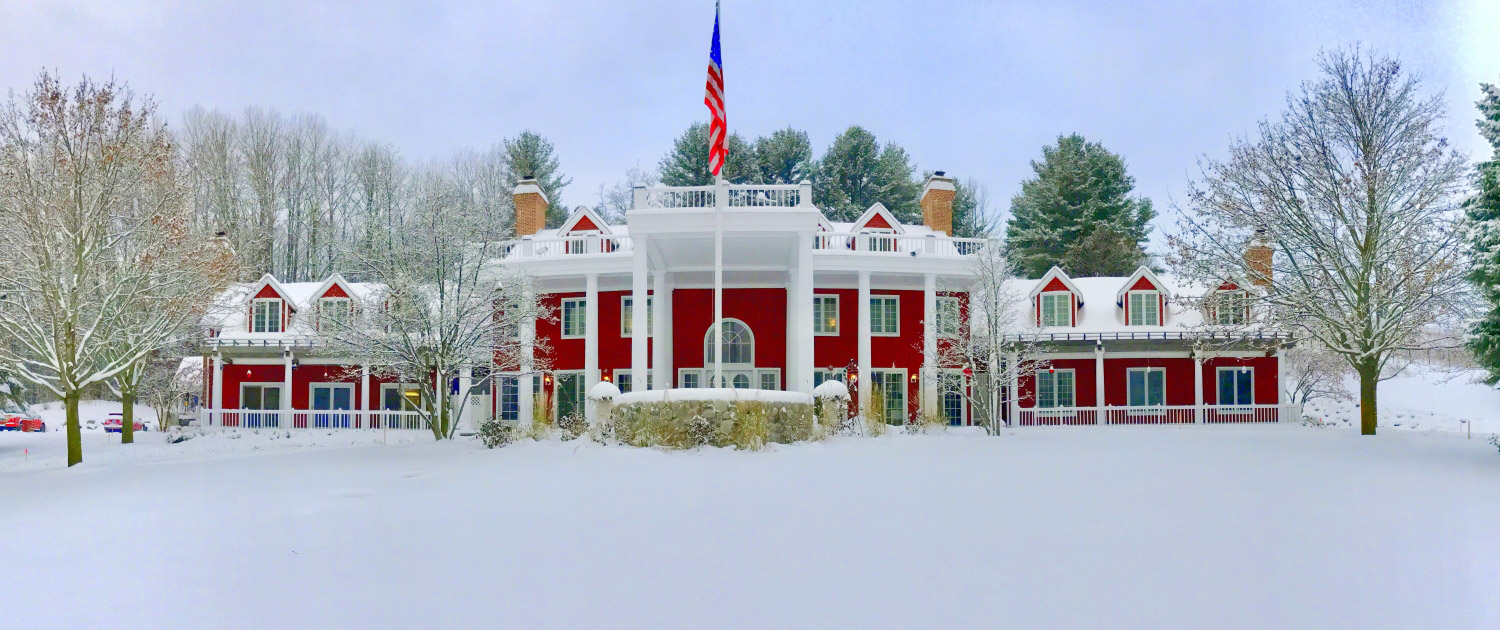 The exterior of our Bed and Breakfast in Traverse City after a snow - a great place for a romantic getaway in Michigan