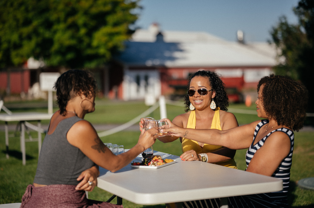 Women enjoying tastings at one of the best Michigan Wineries near Traverse City