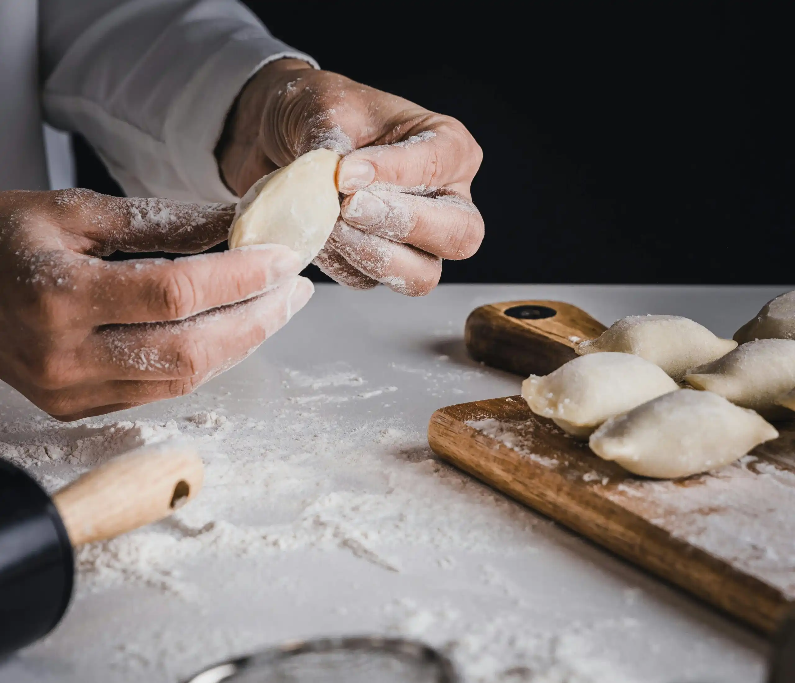 A chef making pierogis.