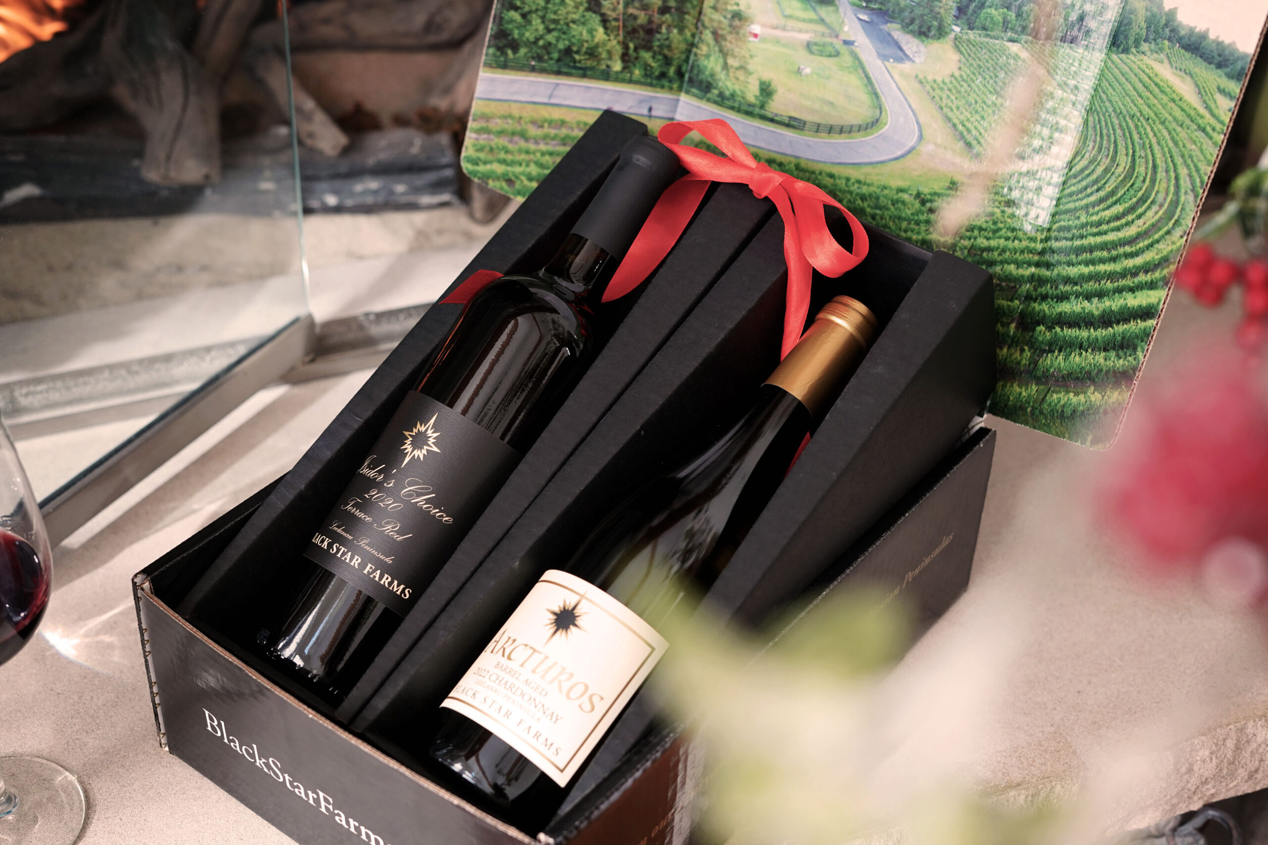 Corporate Gifting 1 Purple beverage with cherry garnish against American flag backdrop.