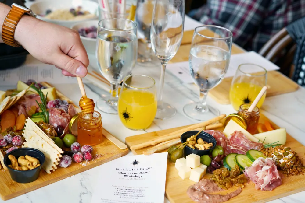 Charcuterie Board Workshop 1 Two charcuterie boards and two mimosas from a past workshop.