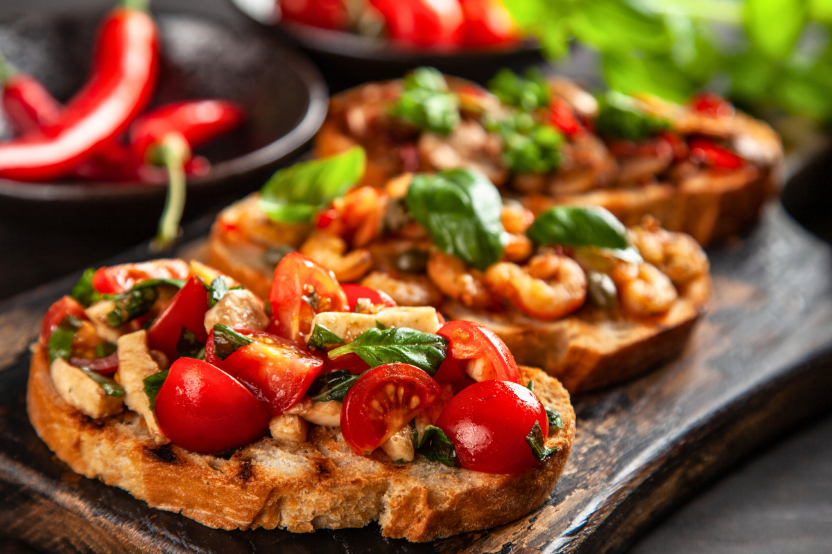Bruschetta with fresh toppings including tomato and basil