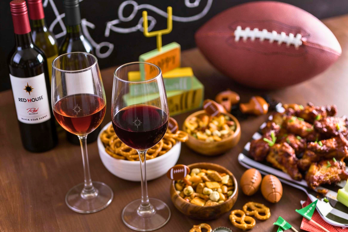 Football with gameday snacks and Black Star Farms wine.